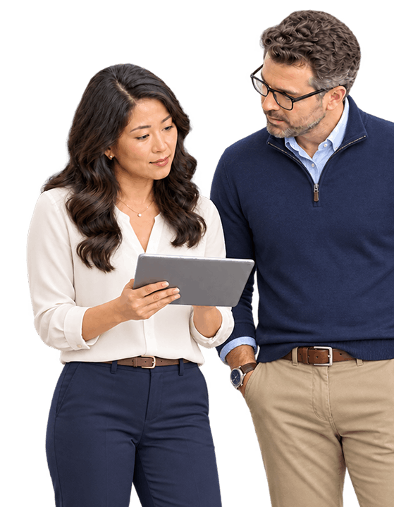 two SPICE™ specialists reviewing a live trading partner program on a tablet